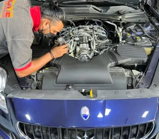 Expert Technician Repairing Maserati at DME Auto