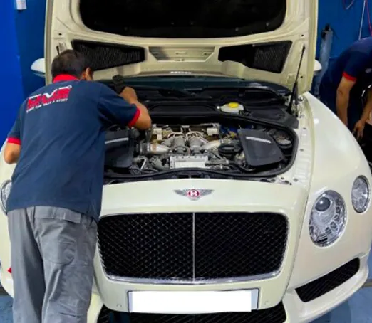 DME Auto Mechanic Servicing White Bentley