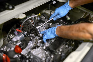 DME Mechanic Working on Car Engine