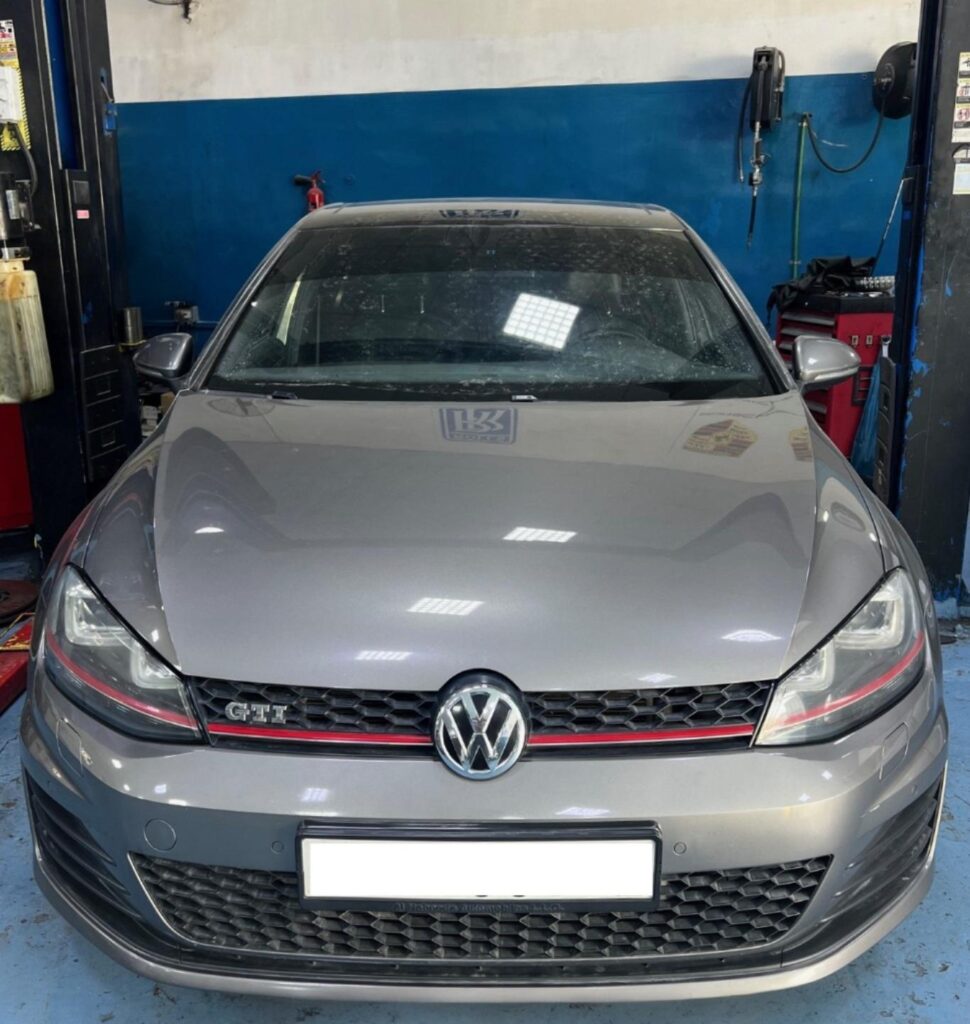 DME Mechanics Repairing Grey Volkswagen Golf