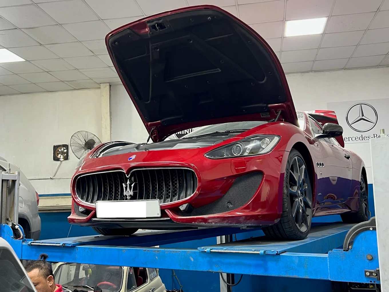 DME Mechanics Servicing Red Maserati GranTurismo