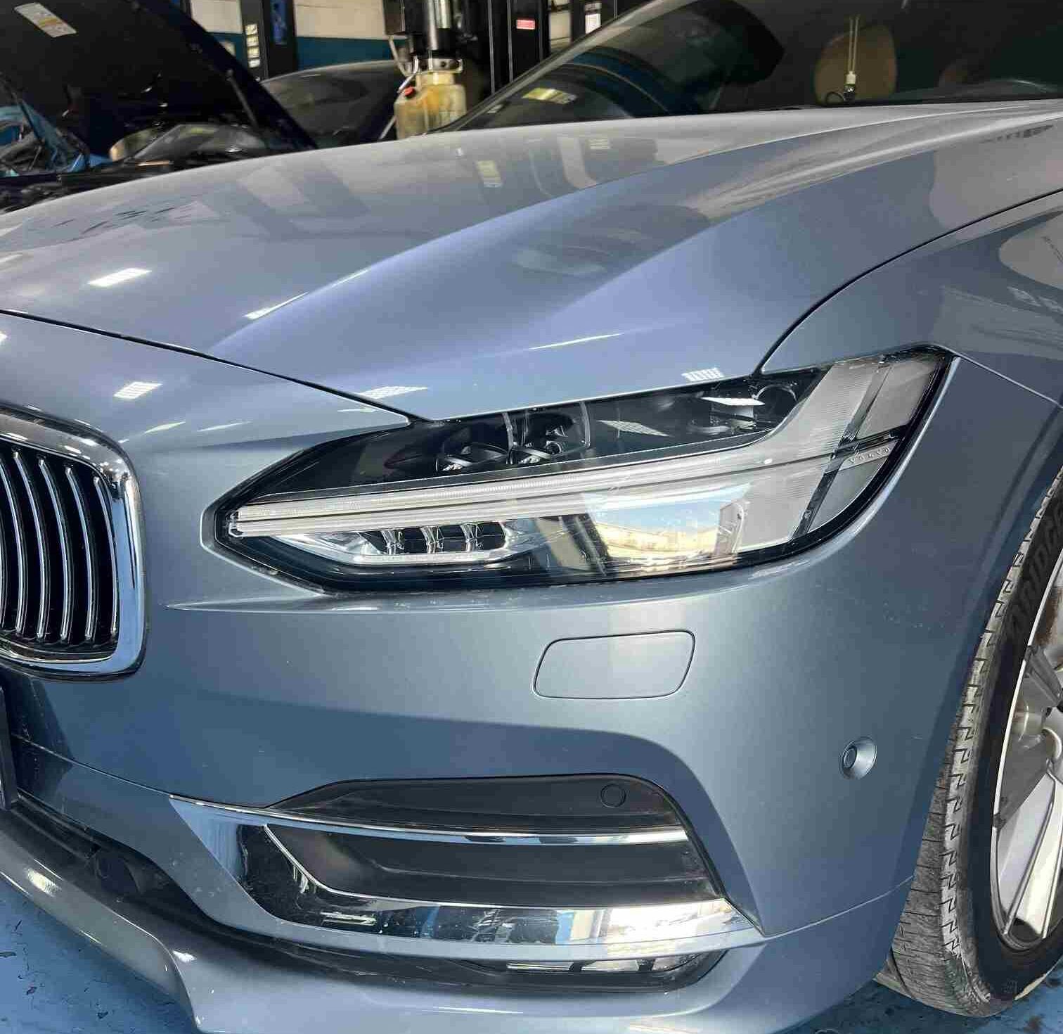 Mechanics Servicing Volvo S90 in DME Auto Center